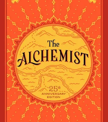 The Alchemist by Paulo Coelho 25th Anniversary Edition book cover with red and gold ornamental design.