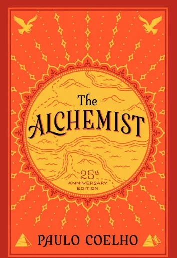 The Alchemist by Paulo Coelho 25th Anniversary Edition book cover with red and gold ornamental design.